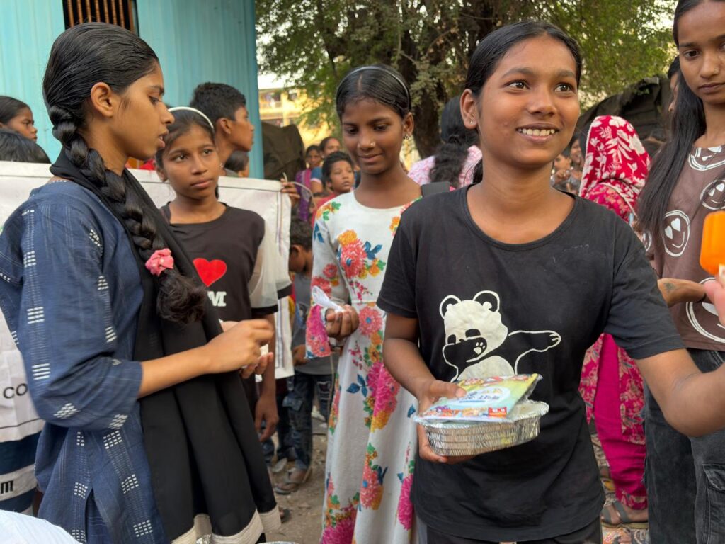 Distribution of Chicken Biryani and Ice Cream to 150 Slum Children in Koperkhairane, Navi Mumbai conducted on 14 March 2026