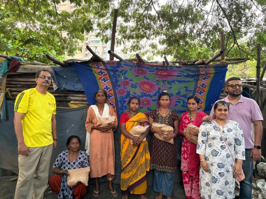 Distribution of ice-cream and released wheat grain for slum families conducted 10 oct 2026